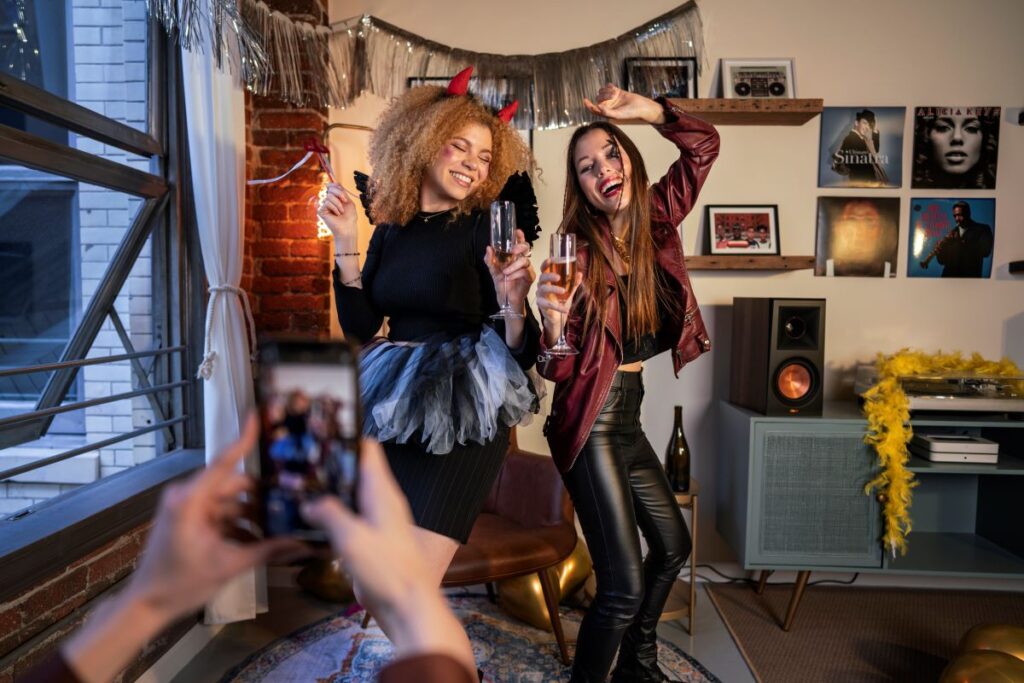 Happy women having fun costumes party